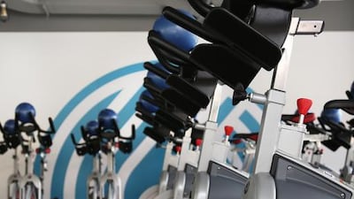 Define Revolution classes on a stationary bike are choreographed to pumping music. Courtesy Define