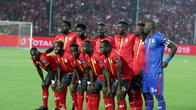 Uganda players pose before the match. EPA