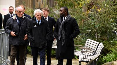 Former Manchester United players Paddy Crerand, centre, and Andy Cole, right, at Manchester Cathedral. PA