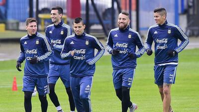 From left to right, Argentina's Lionel Messi, Javier Pastore, Sergio Aguero, Nicolas Otamendi and Marcos Rojo jog during a training session on Wednesday ahead of the Copa America final. Luis Acosta / AFP