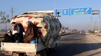 In this frame grab from video a family with their goods loaded on a lorry drives towards the Turkish border in Syria's rebel-controlled Idlib province. AP Photo