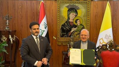 Cardinal Louis Raphael Sako holds up the decree from Iraqi Prime Minister Mohammed Shia Al Sudani. Photo: Chaldean Catholic Church
