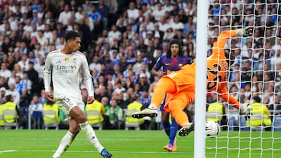Real attacker Jude Bellingham finishes past Barca goalkeeper Wojciech Szczesny to make it 2-1 to the home side just before half-time. Getty Images