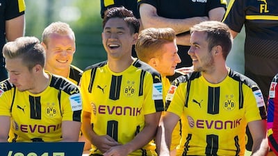 Borussia Dortmund's Shinji Kagawa, centre, at a team photo last week. Guido Kirchner / EPA / August 17, 2016