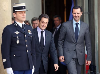 Former French president Nicolas Sarkozy and Syrian President Bashar Al Assad leave the Elysee Palace in Paris after a meeting in 2010. AP