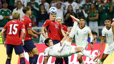 Mexico's Israel Reyes shoots at goal with an overhead kick. Reuters