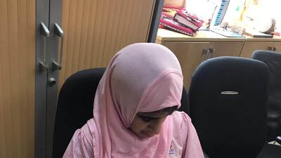 A woman working on the design for the Tolerance Carpet.