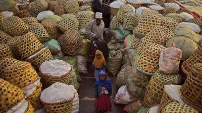 A family on board a ferry loaded with baskets of oranges on Ukerewe Island, Lake Victoria, Tanzania. Carl de Souza / AFP Photo