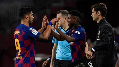 Barcelona's Uruguayan forward Luis Suarez is substituted off for Barcelona´s Guinea-Bissau forward Ansu Fati. AFP
