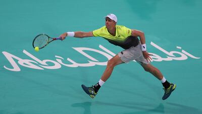 South Africa's Kevin Anderson returns the ball to Austria's Dominic Thiem during their semi-final match at the Mubadala World Tennis Championship in Abu Dhabi. Anderson won 7-6, 6-4. Kamran Jebreili / AP Photo