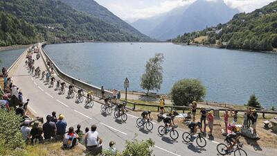 The peloton. with leader Chris Froome in the yellow jersey, ride during Stage 18 of the Tour de France on Thursday through the French Alps. Laurent Cipriani / AP