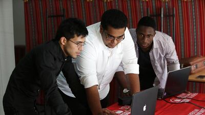Rohit Jaggi, Shuji Shafiq and Hassan Belo – students at the University of Wollongong work on their project. Pawan Singh / The National