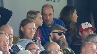 Prince George speaks to Prince William, Duke of Cambridge, during the Premier League match between Norwich City and Aston Villa at Carrow Road. Getty Images