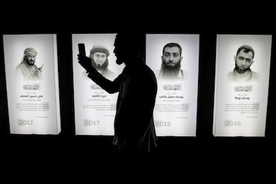 Pictures of people killed during the Syrian civil war on display at the Syrian Revolution Military Exhibition in Damascus. Getty Images