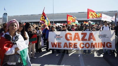 Demonstrators march outside Termini train station in Rome. AP