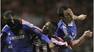 Chelsea's Ashley Cole, left, and Frank Lampard battle Sunderland's Asamoah Gyan on Tuesday.