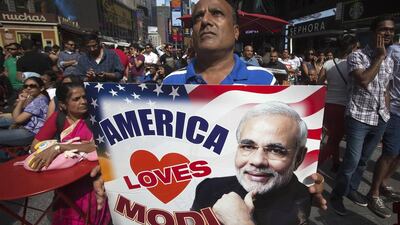 Members of the Indian-American community were gathered in Times Square to watch a live broadcast of Mr Modi’s speech. Carlo Allegri / Reuters