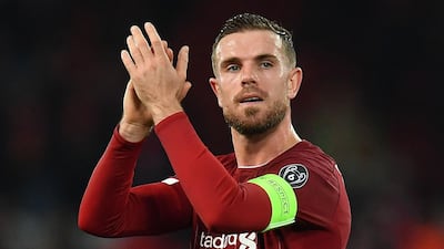 Liverpool midfielder Jordan Henderson applauds at the whistle. AFP