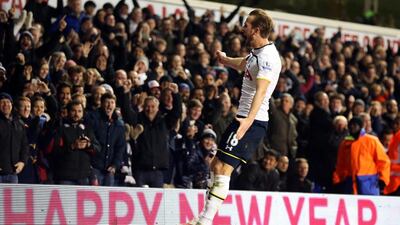 Harry Kane celebrates in front of Tottenham Hotspur supporters after scoring twice against Chelsea on Thursday. Kieran Galvin / EPA
