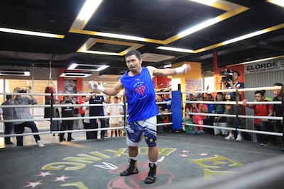 Manny Pacquiao loosens up before beginning pad work. Jake Verzosa for The National