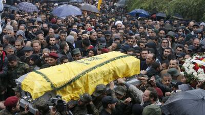 Hizbollah members and relatives carry the coffin of commander Hassan Al Laqis during his funeral in Baalbeck, in Lebanon's Bekaa valley, on Wednesday. Mohamed Azakir / Reuters