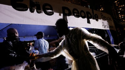 Demonstrators distribute essentials such as water at Gota-Go Village in Colombo, Sri Lanka. Reuters