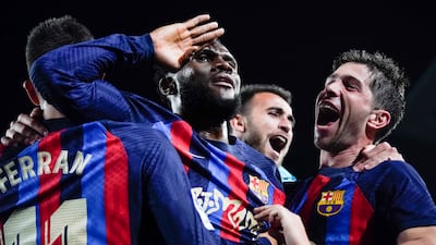 Barcelona's Franck Kessie, centre, celebrates with teammates after scoring his team's winning goal against Real Madrid at Camp Nou on March 19. AP