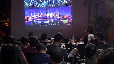 Tunisian poeple watch the Presidential TV debate in a cafe in Tunis. Days before the first round of Tunisia's presidential election, the fledgling democracy is holding three nights of televised debates between the candidates, a rare event in the Arab world. AFP