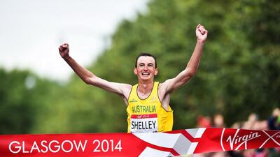 Australia's Michael Shelley celebrates at the finish line as he wins the men's marathon athletics event at the Glasgow City Marathon Course during the 2014 Commonwealth Games in Glasgow, Scotland on July 27, 2014. AFP PHOTO / ANDREJ ISAKOVIC