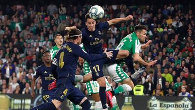 Real Madrid midfielder Lucas Vazquez wins a header against Real Betis. AP Photo