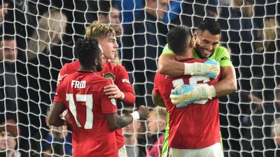 Manchester United's Argentinian goalkeeper Sergio Romero (R) and Manchester United's Argentinian defender Marcos Rojo gesture at the final whistle during the English League Cup fourth round football match between Chelsea and Manchester United at Stamford Bridge in London on October 30, 2019. - RESTRICTED TO EDITORIAL USE. No use with unauthorized audio, video, data, fixture lists, club/league logos or 'live' services. Online in-match use limited to 75 images, no video emulation. No use in betting, games or single club/league/player publications. / AFP / Glyn KIRK / RESTRICTED TO EDITORIAL USE. No use with unauthorized audio, video, data, fixture lists, club/league logos or 'live' services. Online in-match use limited to 75 images, no video emulation. No use in betting, games or single club/league/player publications.