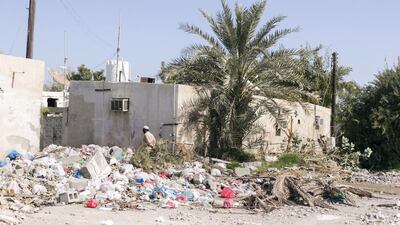 Residents living in the Al Ghurfa neighbourhood of Fujairah contend with rubbish and waste that is continually dumped on the streets. Reem Mohammed / The National