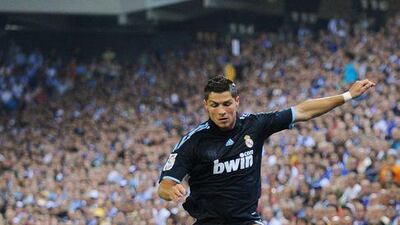 Real's Cristiano Ronaldo hurdles an Espanyol tackle at the Cornella on Saturday.