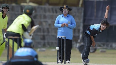 Pakistani national cricket and football player Diana Baig (R), delivers the ball during a domestic cricket championship match in Islamabad in April. Aamir Qureshi / AFP / April 25, 2016