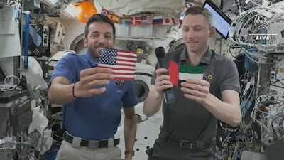 UAE astronaut Sultan Al Neyadi and Nasa's Woody Hoburg hold up the Emirati and US flags aboard the International Space Station. Photo: Nasa TV