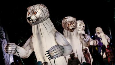 A row of illuminated bear puppets parade during a performance titled 'The Bear's Mouth' by French circus group CIE Remue-Menage, at the Gardens by the Bay in Singapore. EPA