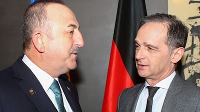 German Foreign Minister Heiko Maas, right, meets with Turkish Foreign Minister Mevlut Cavusoglu during the Munich Security Conference in Munich, Germany. AP