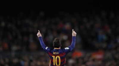 Barcelona’s Lionel Messi, left, reacts after scoring against Espanyol during a Copa del Rey soccer match at the Camp Nou stadium in Barcelona, Spain, Wednesday, Jan. 6, 2016. (AP Photo/Manu Fernandez)
