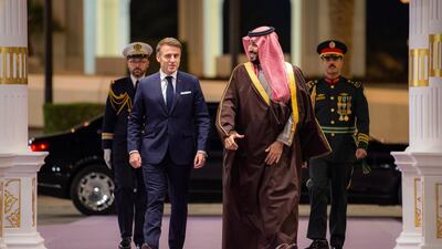Prince Mohammed and Mr Macron arrive at Al Yamamah Palace. EPA