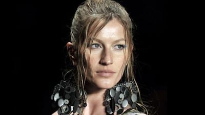 Brazilian supermodel Gisele Bundchen presents an outfit by Colcci during the 2010-2011 Spring-Summer collection of the Sao Paulo Fashion Week, in Sao Paulo, Brazil, on June 13, 2010. AFP PHOTO/Mauricio LIMA