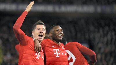 Lewandowski celebrates with David Alaba after scoring Bayern's third goal in the Champions League round of 16 first leg match at Chelsea. Getty