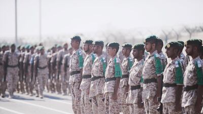 National service recruits stand in formation and march during the visit. Courtesy Wam