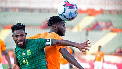 South Africa defender Thulani Hlatshwayo, left, fights for the ball with Ivory Coast midfielder Franck Kessie. AFP