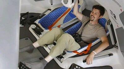 A visitor tries out a model of the orbiting hotel in Russia. Reuters