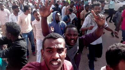 In this Thursday, Dec. 20, 2018 handout photo provided by a Sudanese activist, protesters chant slogans during a demonstration, in Khartoum, Sudan. AP