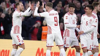 Eriksen celebrates scoring his team's third goal. AFP