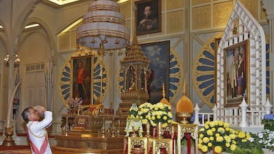 In Thailand ‘s new king Maha Vajiralongkorn Bodindradebayavarangkun pays his respects to a portrait of his late father king Bhumibol Adulyadej and Queen Sirikit at the Dusit Palace in Bangkok on December 1, 2016. Bureau of the Royal Household via AP