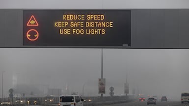 Warning signs urge motorists in Dubai to drive with care in the fog on Saturday. Antonie Robertson / The National