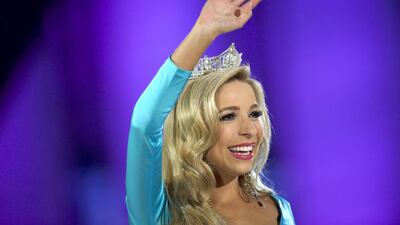 Miss America 2015 Kira Kazantsev waves to the crowd as she has a final walk as Miss America. Reuters