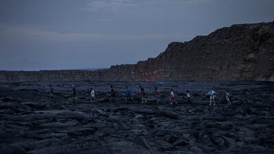 Tourists at the volcano's lava fields